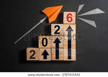Wooden Cube Block Charting a Course for 2026 Success. Concept 2026 New Year background. Business, resolutions, goals, inspiration, success, ideas. High quality photo