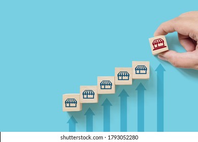 Wooden cube block with icon store and copy space for your text. Franchise business marketing system concept. Structure service store network strategy - Shutterstock ID 1793052280
