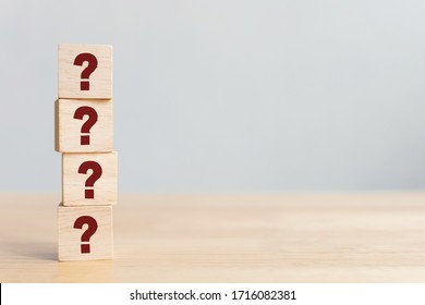 Wooden Cube Block Shape With Sign Question Mark Symbol On Wood Table