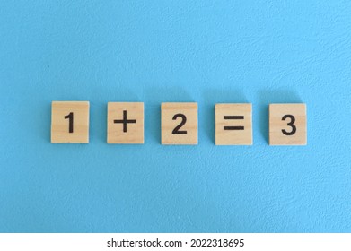 Wooden Cube Blocks With One Plus Two Equal Three. Math Concept