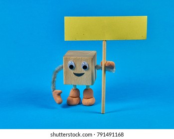 Wooden cube as a character holding a blank sign. Place for your text. - Powered by Shutterstock