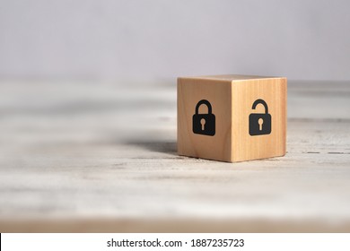 Wooden Cube With An Open And Closed Lock Pattern. Day Of Protection Of Personal Data. Protection Of Personal Information