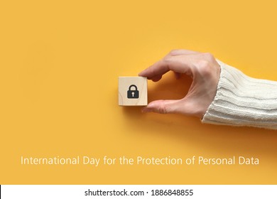 Wooden Cube With A Picture Of A Closed Lock. Day Of Protection Of Personal Data. Protection Of Personal Information