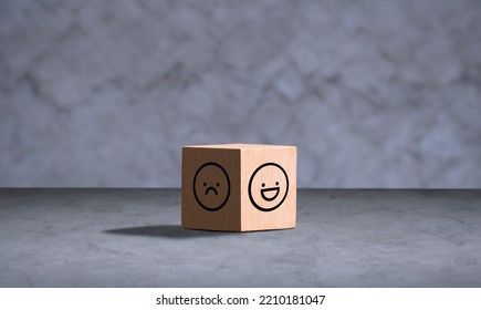 Wooden Cube With Smile Face In Bright Side And Sad Face In Dark Side On Concrete Background In Vintage Tone Style, Concept Of Mental Health And Positive Emotional State Selection