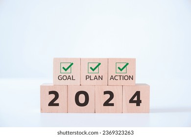 Wooden cubes with 2024 and goal, plan, action icon on white background. 2024 goals of business or life. Starting to new year. Business common goals for planning new project, annual, target achievement