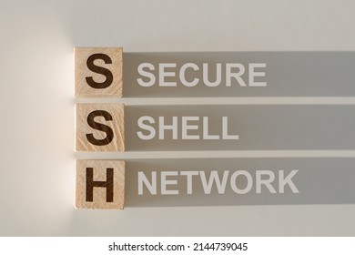 Wooden Cubes Building Word SSH Abbreviation Secure Shell Network On Light Gray Background.