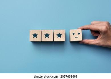 Wooden Cubes With Drawings Of Stars. The Symbol Of The Average Rating. Three Stars