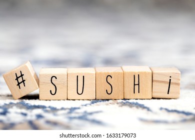 Wooden Cubes With A Hashtag And The Word Sushi, Social Media And Food Concept Retro