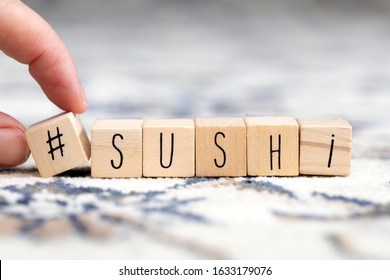 Wooden Cubes With A Hashtag And The Word Sushi, Social Media And Food Concept Retro