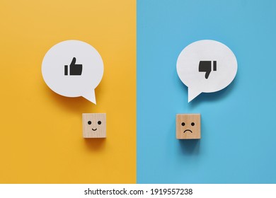 Wooden cubes with the image of like and dislike. Choose between like and dislike