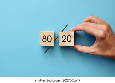 Wooden cubes with the inscription: 80% to 20%. The Pareto principle