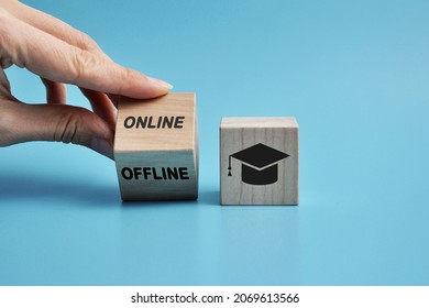 wooden cubes with the inscription: online or offline training. Symbol for choosing online or offline training
