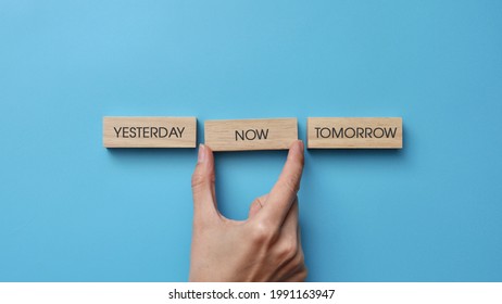 Wooden cubes with inscriptions: yesterday, tomorrow, now. A person's choice of the present moment - Shutterstock ID 1991163947