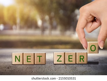 Wooden cubes with net zero icon in natural background. Net zero Carbon neutral. Net zero greenhouse. Climate neutral long strategy. - Shutterstock ID 2155010531