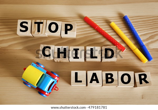 Wooden cubes with space for text with pencils\
and toy car on wooden\
background