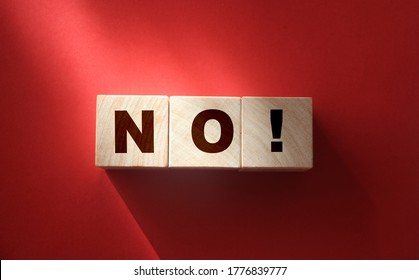 Wooden cubes with text no on a red background. Negative answer concept. No risk, no violence or no discrimination concept. - Shutterstock ID 1776839777