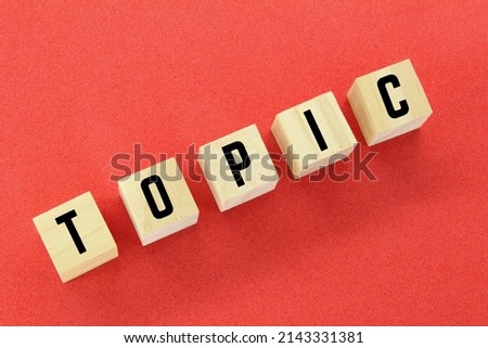 wooden cubes with topic words. topic concept or discussion