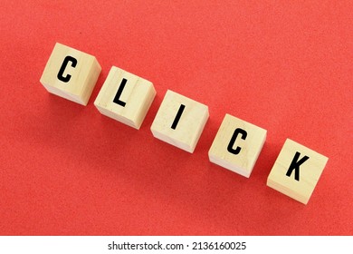 wooden cubes with the word click on the top square - Shutterstock ID 2136160025
