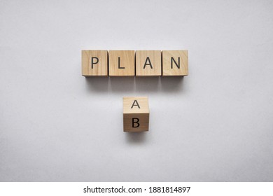 Wooden Cubes With The Word Plan And Option A And B. Choose Between Two Options For Action In Life