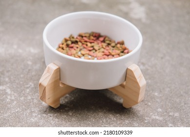 Wooden custom display for pet food bowl. Handmade cat dining table. - Shutterstock ID 2180109339
