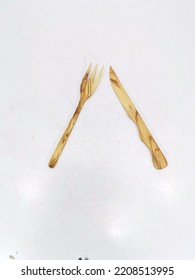 Wooden Cutlery Set On A White Background