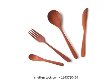 wooden cutlery sppons forks knife closeup isolated on white background