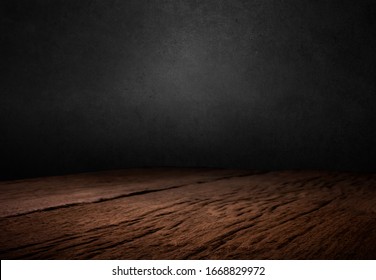 Wooden dark desk studio free space for your decoration product.Black background with space for your text. 