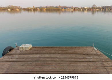 Wooden Deck Floating Pontoon Dock At Calm River Water