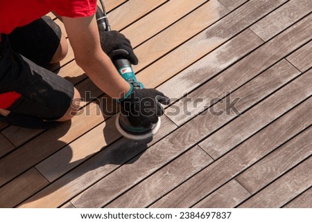 Wooden deck sanding with power sander tool, before after effect