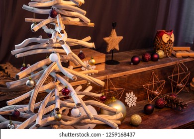 Wooden decorative Chrismas tree with hand balls. Stylish Christmas interior decorated in rustic style. Driftwood christmas - Powered by Shutterstock