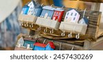 Wooden decorative key holder houses sold on annual Nations Fair, where masters from the national communities of Lithuania present their arts, crafts and traditions. Vilnius, Lithuania.