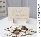 Wooden decorative wedding guest book. Wedding accessories. Your wedding guestbook should be special and personalized. HEARTS FOR SWEET SAYINGS on laser-cut wooden hearts that your guests can sign on.