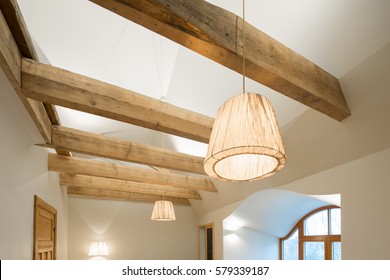 Wooden design. Wooden beams and floor to ceiling as a design element. Modern interior.