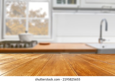 Wooden Desk Of Free Space And Kitchen Interior. Sunny Warm Day. 