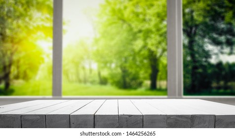Wooden desk of free space and window background  - Shutterstock ID 1464256265