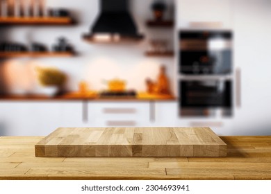 Wooden desk of free space for your decoration and blurred kitchen background in home interior.  - Powered by Shutterstock