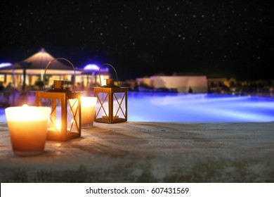 Wooden Desk With Lamp In Hotel Restaurant And Romantic Night 