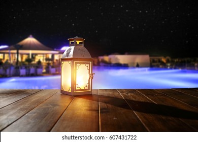 Wooden Desk With Lamp In Hotel Restaurant And Romantic Night 