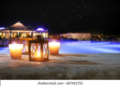 Wooden Desk With Lamp In Hotel Restaurant And Romantic Night 