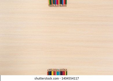 Wooden Desk Workplace Top View Nobody Color Pencils At The Top And Bottom Of Shot