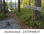 Wooden directional sign pointing towards Törmälä in Southern Konnevesi National Park, Finland