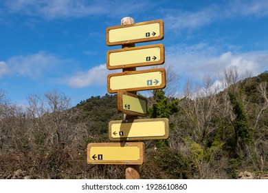 Wooden Directional Trail Sign In Mountain With Different Hiking Trails In Santa Ana La Real, Huelva, Spain