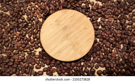 Wooden Disc On Coffee Beans
