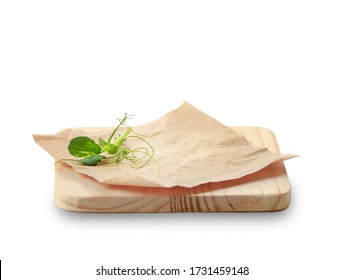 Wooden Dish Board And Crumpled Paper Decorated With Green Leaves Isolated.Food Advertisement Design.Plate To Display Food.Empty Space Dishware To Promote Product.Organic Concept.