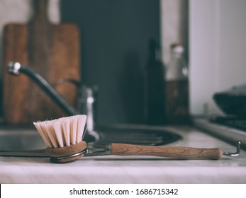 Wooden Dish Brush In A Sink In The Kitchen