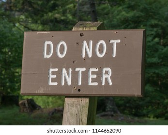A wooden do not enter sign in a state park, Vermont, USA