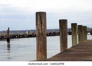 Wooden Dock Pier At Coastal Harbor Beach Marina 