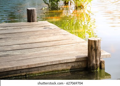 Wooden dock with sunlight on the lake