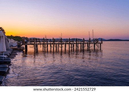 wooden dock with sunrise. beautiful colorful sunrise by the sea