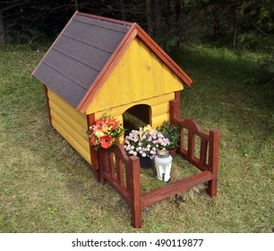 Wooden Dog House As A Monument On The Grave